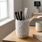 Handcrafted white concrete pen holder styled on a modern office desk with stationery in a minimalist workspace.