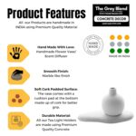 Product features of the handcrafted white concrete round bud vase by The Grey Blend, highlighting its smooth marble-like finish, protective cork padding, and durable premium concrete material made in India.