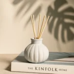 White handcrafted concrete reed diffuser bottle with 5 natural reed sticks for modern home decor