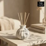 Close-up of handcrafted white concrete reed diffuser with ribbed texture and matte finish